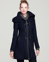 From the stand collar with zip-off hood to the glossy trio of leather loop toggles, this Mackage wool coat embellishes a cool-weather classic with on-trend notes.