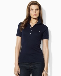 Designed for a trim, body-skimming fit in soft finely ribbed cotton, the iconic polo shirt receives a chic update with gleaming silver-tone metal buttons.