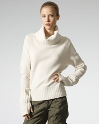 Crafted in a luxe blend of cashmere and wool, the classic turtleneck sweater exudes ultimate comfort and style.