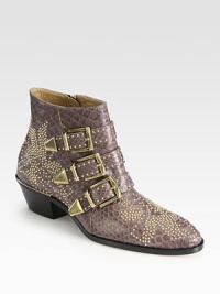 Edgy metal studs freshen this on-trend ankle boot, impeccably crafted in Italy of luxurious genuine python. Stacked heel, 2 (50mm)Python upper with metal studsSide zip and adjustable buckle strapsLeather lining and solePadded insoleMade in Italy