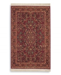 Richly detailed and deeply colored, the exotic floral motif of this rug made its debut in twentieth-century America and has remained a favorite. Individual skein-dyeing imparts a jewel-tone clarity to the rich red, green and ivory palette. A patented wash process creates a soft vintage finish faithful to the craftsmanship of the original. Woven in the USA of premium fully worsted New Zealand wool.