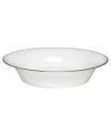 Dress up any veggies or sides with this fine china serving dish. From innovative designer Monique Lhullier, it features a platinum-edged tiered scallop pattern on creamy white.