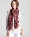 In a pink Burberry check, this oblong scarf offers lightweight luxe with its sheer, gauzy fabrication.