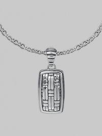 Polished silver with a military mind, crafted in a dogtag design with the look of laticework. From the Bedeg Collection Sterling silver Chain necklace 1W X 2¼L Lobster clasp Made in Bali 