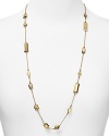 A smattering of gleaming rectangular bars dress up a simple chain on this long kate spade new york necklace, plated in gold.