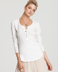 Ruffles and lace lend feminine appeal to Free People's cotton, crochet-embellished henley. Wear it with a full skirt and strappy wedges for a complete look.