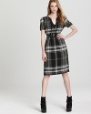 Preppy meets punk as a tonal palette imbues this checked Burberry Brit dress with modern edge. Just add chunky boots and you've got the perfect boy-meets-girl mix.