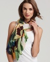 Soft abstract flowers decorate this luxurious cashmere and silk scarf from Bindya.