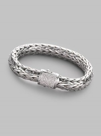 A rich woven chain of sterling silver with a barrel clasp of 18k white gold and pavé diamonds. Diamonds, 0.62 tcw Sterling silver and 18k white gold Length, about 7½ Width, about ¼ Push-lock clasp Made in Bali