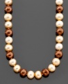 Add spark to your style with this unique strand of pearls. Featuring various shades of cultured freshwater dyed chocolate pearls (6-7 mm). Approximate length: 18 inches.