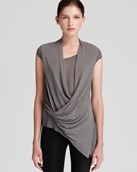 Bring sophistication to your t-shirt collection with this expertly draped Helmut Lang tee with asymmetrical hem.