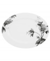 Subdued in shades of gray, the vivacious florals of Moonlit Garden dinnerware adorn this sleek oval serving platter with modern romance. In durable Lenox porcelain.