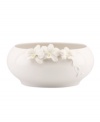 Sculpted orchids pop with a tinge of yellow against this glossy white Flora bowl A quiet beauty in graceful Lenox porcelain.