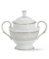 A sweet sensation for your table. This essential sugar bowl is crafted in bone china with a delicate floral design with textured white beads and elegant platinum trim. From the Lenox dinnerware collection.