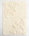 Featuring one of the most elegant designs from Lenox, this Opal Innocence bath rug creates a refined look for your bathroom. Crafted with a beautiful design of scrolling vines, this tufted and carved cotton rug carries with it exceptional style and grace.