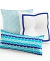 This Trina Turk Caprice Medallion decorative pillow features blue wave-shaped embroidery that evokes a cool, aquatic setting. Zipper closure.