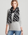 Keep your cold weather style young, wild and free in this zebra-print, oblong scarf from Aqua.