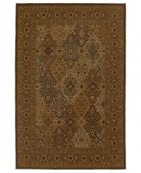 A traditional panel design is woven of supreme New Zealand wool in the Ellsworth area rug in antique tones of mocha, brown, celadon and beige for a truly rich addition to old-world interiors.