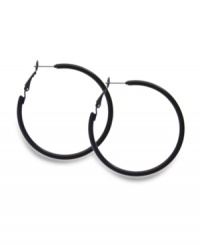 Non-traditional hoops make a bold, style statement. Style&co. earrings crafted in black enamel over mixed metal for a look that will turn heads. Approximate diameter: 1-1/2 inches.