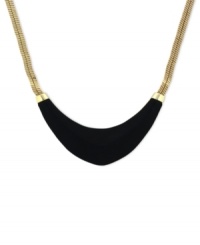 Blend rich elements for pure fashion. Vince Camuto's collar necklace highlights a black leather-wrapped half-moon pendant. Crafted in gold tone mixed metal. Approximate length: 18 inches.