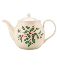 Perfect for entertaining, this porcelain teapot is trimmed with gold and a holly motif to match the beloved Lenox Holiday dinnerware collection.