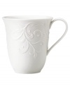 An elegant white-on-white pattern featuring an embossed vine motif and interior glaze lends the Opal Innocence Carved mug to refined dining every day.