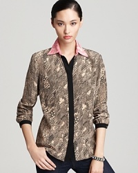 A sultry silk in slithering snakeskin makes this Trina Turk top a wildly covetable addition to your wardrobe.