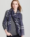 In a blue-and-gray Burberry check, this oblong scarf offers lightweight luxe with its sheer, gauzy fabrication.