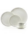 Sleek coupe dinnerware fringed with shimmering leaves of platinum and mica turns your table into a springtime utopia. Clean lines and whites create a vision of modern elegance in banded bone china place settings.