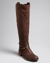 STEVEN BY STEVE MADDEN gets harness-happy with triple strap details at each ankle of this tall pair of boots. Slightly Western touches keep them right in step with the season.