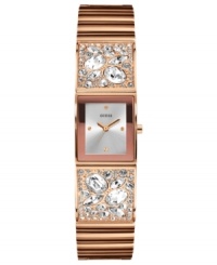 Warm glam, by GUESS. This stunning watch from GUESS flaunts a rosy bangle bejeweled with sparkling crystals.