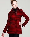 This red haute bouclé Mackage coat features variegated color, leather trim and a classically feminine silhouette to create a look that's truly modern.