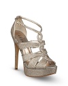 Sensual, sparkling straps twist and turn up these sensational GUESS evening sandals, in a retro-right look that's pure magic; by GUESS.