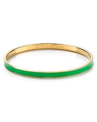 Go easy and green with this simply styled bangle from kate spade new york. Cast in glistening 12-karat gold, it's a stackable stroke of luck.