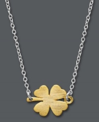 Good luck style with a modern twist. Studio Silver keeps up with the trends by taking a classic clover pendant and flipping it on its side. Crafted in sterling silver and 18k gold over sterling silver. Approximate length: 16 inches + 2-1/2-inch extender. Approximate drop: 1/2 inch.