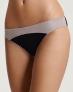 Add a modern accent to your intimates collection with this colorblock bikini from Calvin Klein. Style #F3160