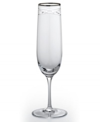 Commemorate a special anniversary with a simply elegant reminder of the time you said, I do. This radiant crystal flute is hand-engraved with interlocking bands that symbolize the rings exchanged between bride and groom. A platinum rim provides a graceful finish.