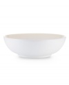 With clean lines in shades of white, the Kealia vegetable bowl dishes out casual fare with modern elegance, plus all the convenience of dishwasher- and microwave-safe stoneware. From Noritake's collection of white dinnerware.