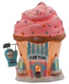 A sweet spot in North Pole Village, Yum Yum Cupcakes bakes up dozens of sugary treats all year long. Frosted windows and a roof sprinkled with shine make it an irresistible collectible from Department 56.