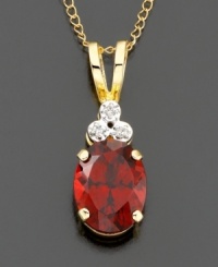 An elegant look created by three diamond accents atop a rich oval-cut garnet (1-3/4 ct. t.w.). Set in 14k gold. Chain measures 18 inches; drop measures 3/4 inch.