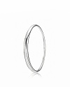 PANDORA's sterling silver bangle in an elegant, organic shape is a complement to any outfit.