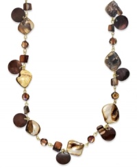 Shift into neutrals. Brown shells and topaz plastic beads adorn this bohemian-chic long necklace by Style&co. Crafted in gold tone mixed metal. Approximate length: 43 inches.