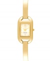 Sleek minimalism for everyday style from Nine West. Crafted of gold tone mixed metal bracelet and rectangular case. Champagne dial features gold tone dot markers, numerals at twelve and six o'clock, hour and minute hands, sweeping second hand and logo at six o'clock. Quartz movement. Limited lifetime warranty.