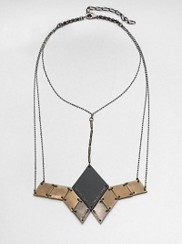 From the Facet Collection. This head-turning statement necklace suspends a grouping of diamond-shaped discs of antiqued and powder-coated brass from a network of gunmetal chains.BrassLength, about 14½Lobster claspMade in USA