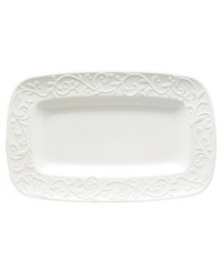 An elegant white-on-white pattern featuring an embossed vine motif and interior glaze lends the Opal Innocence Carved hors d'oeuvres tray to refined dining every day.