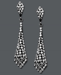 It's a black tie affair. Kaleidoscope's elegant tie-shaped drop earrings shine feature round-cut smokey crystals. Set in sterling silver with Swarovski elements. Approximate drop: 1-1/2 inches.