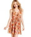 Pretty in print: gauzy, floral print and a unique tie-front design makes this twirly, a-line dress from American Rag magically femme!