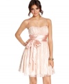 Overlaid in girlish lace and adorned with a sweet satin sash, this dress from B Darlin caters to your femme party style.