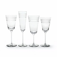 Kate Spade and Lenox join together to bring ease, elegance and understated wit to the table. Library Stripe Stemware features frosted stripes on tall, elegant stems. Shown from left to right: goblet, flute, iced beverage, wine glass. Coordinates perfectly with the Library Stripe Dinnerware.