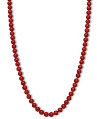 Crimson chic. This brilliantly-hued strand necklace features bold red agate beads (150 ct. t.w.) in a polished 14k gold setting. Approximate length: 18 inches. Approximate bead diameter: 7 mm.